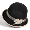 Close-up of black woven women's hat with silk flower, rhinestones and faux pearls decoration - M (56-58cm) / Black