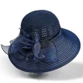 Detail of blue sun hat featuring a delicate organza flower and breathable knit texture - M / Navy Blue