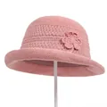 Detailed close-up of a pink knitted sun hat showing delicate crochet flower textures - M / Pink