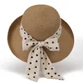 Elegant women's straw sun hat with creamy white polka dot bow ribbon on white background - M / Khaki