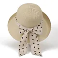 Detailed weave texture of beige straw sun hat featuring a classic polka dot bow ribbon - M / Beige