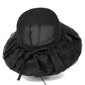 Detail of black sun hat with mesh crown, wide pleated brim, and subtle floral butterfly motifs - M / Black