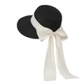 Detail of elegant black straw sun hat featuring a large cream bow with long ribbons - M / Black With Off-white Bow