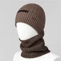 Detailed knit texture of brown wool winter hat and scarf set with brand label - Coffee