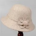 Detail of beige wool felt cloche hat featuring a floral ornament and pink fuzzy pom-pom - M (56-58cm) / Round Top with 3D Flower and Fur Ball / Beige