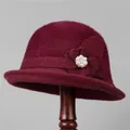Detail of burgundy knitted bucket hat showing floral applique with pearl and rhinestone - M / Burgundy