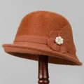 Detailed macro of vintage knit cloche hat featuring a 3D fabric flower with pearls - M (56-58cm) / Caramel color