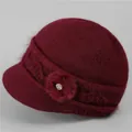 Detailed view of dark red knitted wool hat with side floral accent and soft plush texture - One Size Stretchy / Burgundy