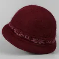 Detailed texture of burgundy knit bucket hat with plush faux fur and floral jacquard trim - One Size Stretchy / Burgundy
