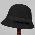 Close-up of black wool felt hat featuring a decorative bow on a wooden stand - M (56-58cm) / Black