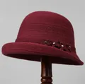 Detail of burgundy knitted bucket hat showing floral applique with crystal accents - M (56-58cm) / Burgundy
