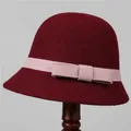 Detailed texture of a vintage wool felt cloche hat with pink ribbon and bow - M (56-58cm) / Burgundy