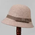 Detail view of pink wool cloche hat with textured fabric and elegant ribbon bow - M (56-58cm) / Mocha