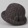 Close-up of winter knit hat for elderly women with purple floral weave and side bow - M (56-58cm) / Dusty Pink