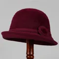 Detailed texture of burgundy knitted cloche hat featuring a decorative floral accent and fur ball - M (56-58cm) / Burgundy