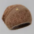 Detail of soft brown knit beanie with plush texture and golden rhinestone logo emblem - One Size Stretchy / Coffee