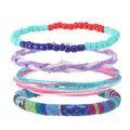 Set di 4 braccialetti in stile boho con perline colorate e motivi in tessuto intrecciato - Stile Sovrapponibile Colorato (Stile A)