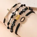 Dettaglio di set di braccialetti religiosi con Vergine Maria e ciondoli Malocchio - Nero