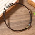 Detail of double-strand brown leather necklace with textured vintage metallic beads - Three Tone Metal Cylinders (17)