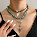 Set collana boho a strati con perle turchesi, ciondolo a testa di toro e cordoncino marrone - Design Testa di Toro (3)