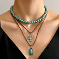 Detail of bohemian layered necklace set with turquoise beads and silver cactus pendant - Oval Turquoise And Cactus (6)