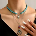Bohemian layered necklace featuring turquoise beads and vintage silver ring pendant - Arrowhead And Circle (9)
