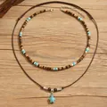 Double-layered necklace with wooden beads, turquoise turtle charm and brown rope cord - Turtle And Wood Beads (20)