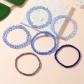 Set di cinque braccialetti elastici impilabili in perline di cristallo blu e viola - Stile Blu