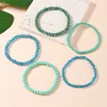 Set di cinque braccialetti elastici impilabili con perle di cristallo verdi e blu - Stile Blu Ciano