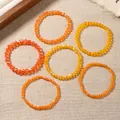 Set of six warm-toned crystal bead elastic bracelets in orange and yellow hues - Orange Red Style