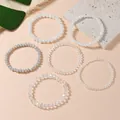 Stackable stretch beaded bracelets with faux crystal in white, grey, and clear tones - White Style