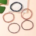 Five-piece stackable elastic bracelets featuring faceted artificial crystal beads in varied hues - Purple Character