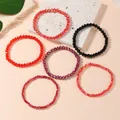 Stacked stretch beaded bracelets set with multifaceted artificial crystals in mixed red and black - Deep Red Style