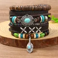 Handgemachtes mehrlagiges Lederarmband-Set mit Türkis und Boho-Perlen auf Holz - Kreuz und Federanhänger Kombination (5)