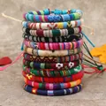 Set di 11 braccialetti intrecciati in stile bohémien con motivi etnici e nodi regolabili - Modello B
