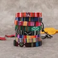 Set di otto braccialetti bohémien intrecciati in cotone con motivi geometrici ed etnici - Modello D