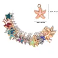 Détail macro de pendentifs étoile de mer colorés montrant l'émail et la taille 1,5 cm - Pendentifs Étoile Étoile de Mer Mixtes / Rose vif