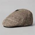 Detail of vintage brown plaid flat cap featuring a black leather brim and decorative button - M(56-58cm) / Coffee
