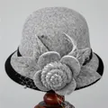 Detailed view of gray wool cloche hat featuring felt flower mesh veil and feather accents - M (56-58cm) / Gray
