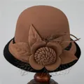 Detail of wool cloche hat featuring decorative flower, delicate feather and mesh netting - M (56-58cm) / Light Coffee