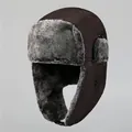 Detail of warm winter aviator hat featuring plush grey faux fur lining and windproof fabric - M (56-58cm) / Coffee