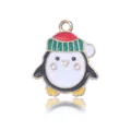 Cute Christmas penguin charm in black and white enamel with golden alloy finish - Penguin