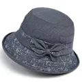 Women's dark blue bucket hat with bow detail and white geometric lines for sun protection - M / Blue