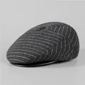 Detail view of winter flat cap with striped wool texture and black leather brim - M (56-58cm) / Dark Gray
