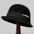 Detail of black wool knit bucket hat featuring five white pearls on a silk ribbon band - M (56-58cm) / Black