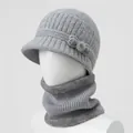 Detailed close-up of grey knitted hat with bow decoration and fleece-lined winter neck warmer - Hat And Neck Warmer / Gray