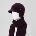 Detail of deep purple knit hat featuring a floral ornament and matching warm ribbed scarf - Purple (Hat And Scarf)