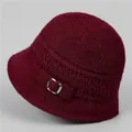Close-up of deep wine red knitted winter bucket hat with silver metal buckle detail - M / Burgundy