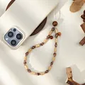 Close-up of handmade wooden bead phone strap with striped decorative accents and natural texture - Striped Colored Bead And Wood Bead Style (ML467)