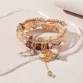 Pulsera boho multicapa de cuentas con colgantes de luna y estrella en soporte - Marrón
